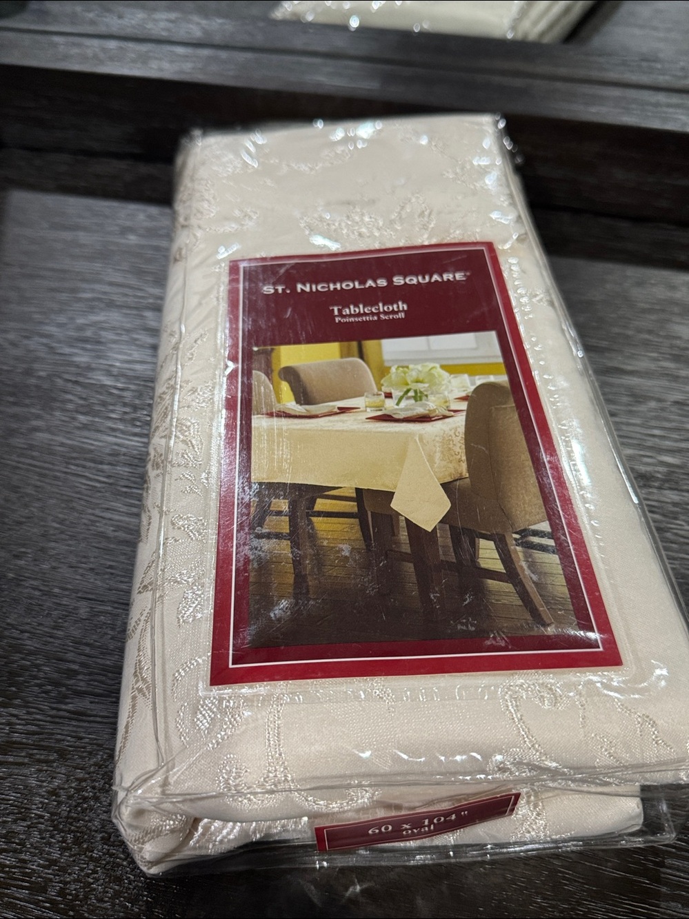 St. Nicholas oval tablecloth  poinsettia scroll 60x104 new with flaw